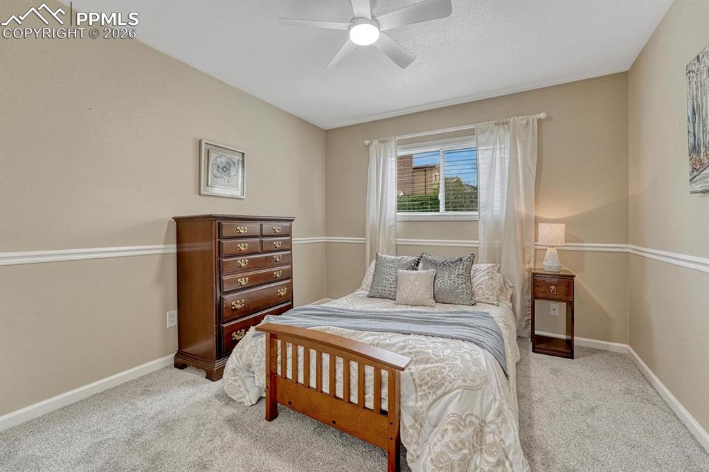 Image 27 of 42: The second upper-level bedroom is great for family or a secondary guest spa