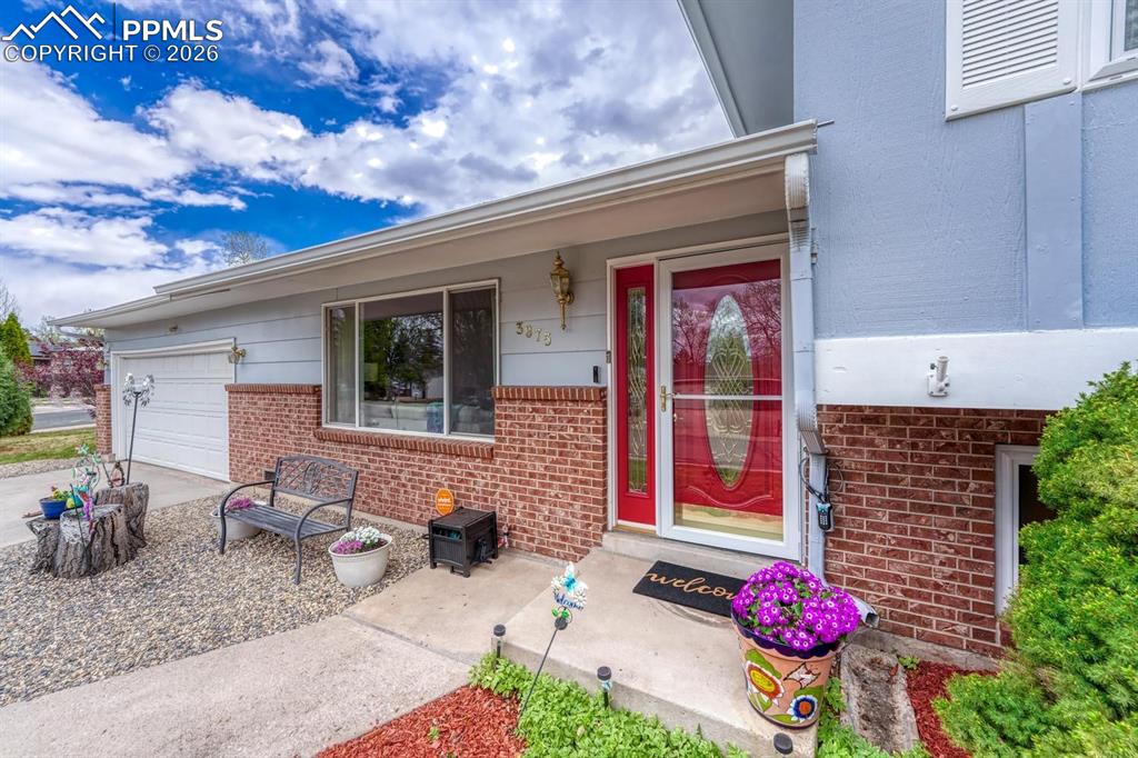 Image 3 of 42: Step up to the inviting front entry, featuring a lovely porch area where yo