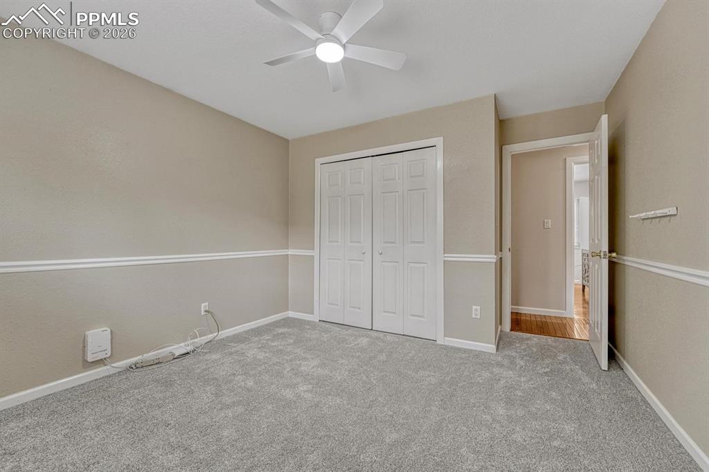 Image 31 of 42: With convenient double closet doors, this versatile upper bedroom provides 
