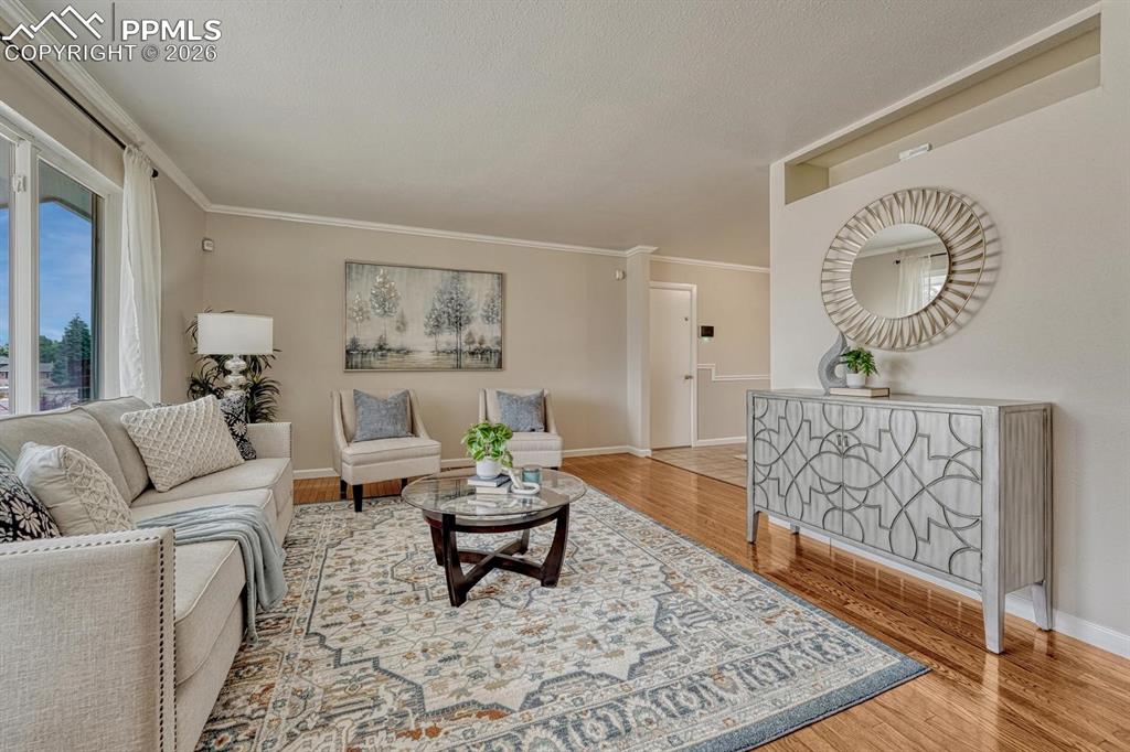 Image 6 of 42: The living area flows seamlessly from the front door into the dining space,