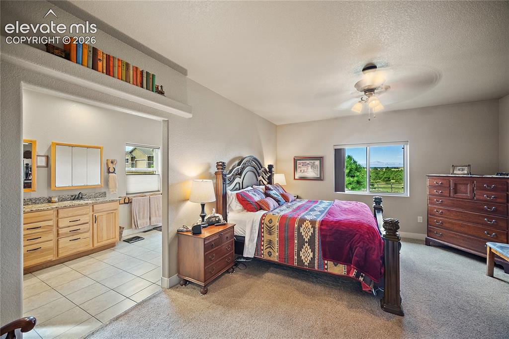 Image 18 of 42: Primary suite with attached 4 piece bath and walk in closet. Don