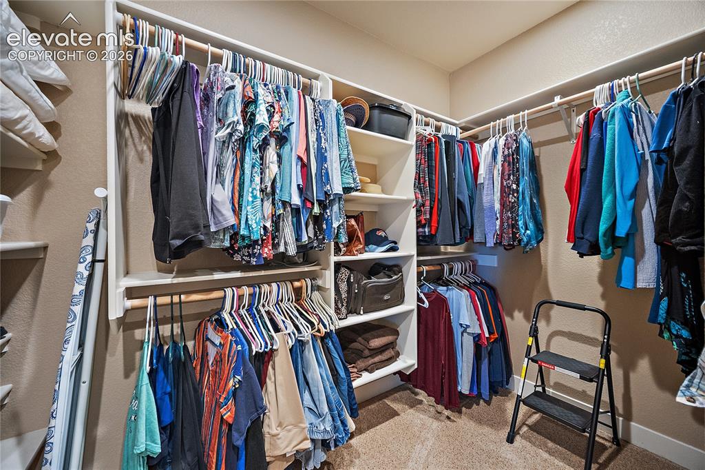 Image 21 of 42: Walk in closet