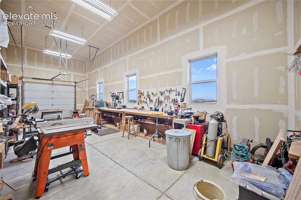 Image 33 of 42: Workshop could also accommodate parking for 2-3 cars. 
