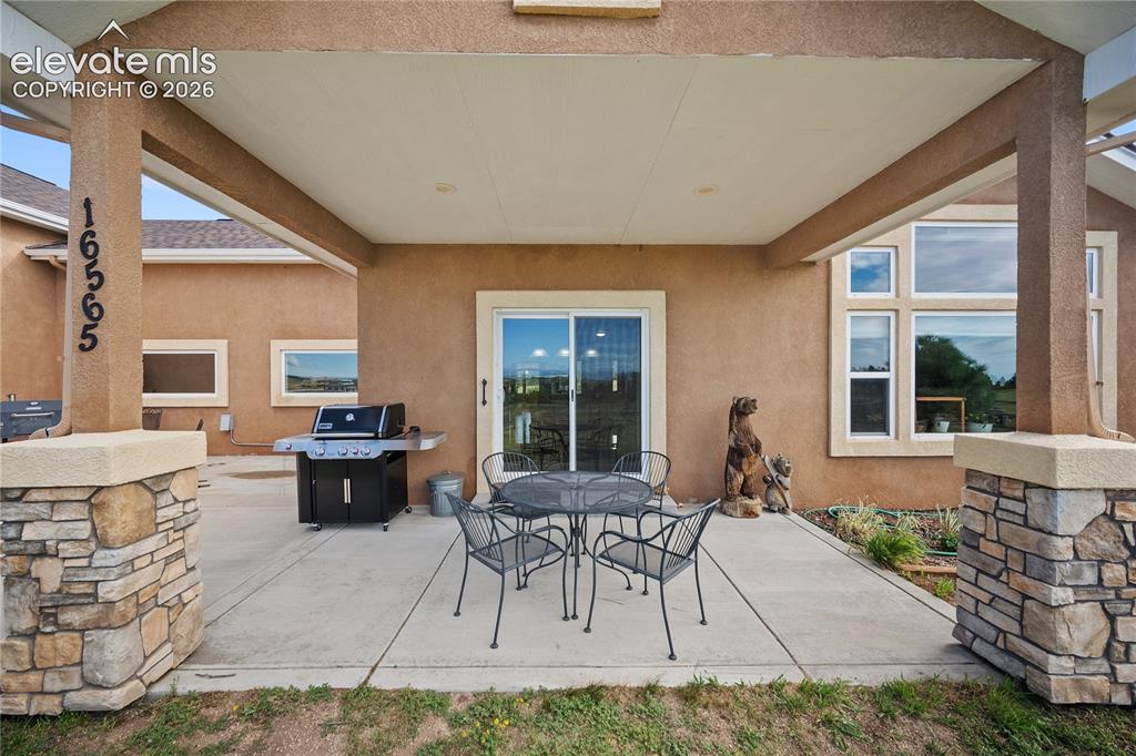 Image 9 of 42: Covered patio and entertaining space with endless possibilities.