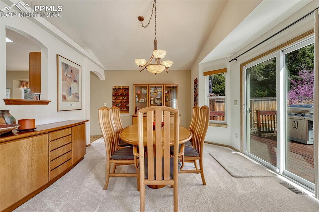Image 10 of 50: Formal dining room with walk out