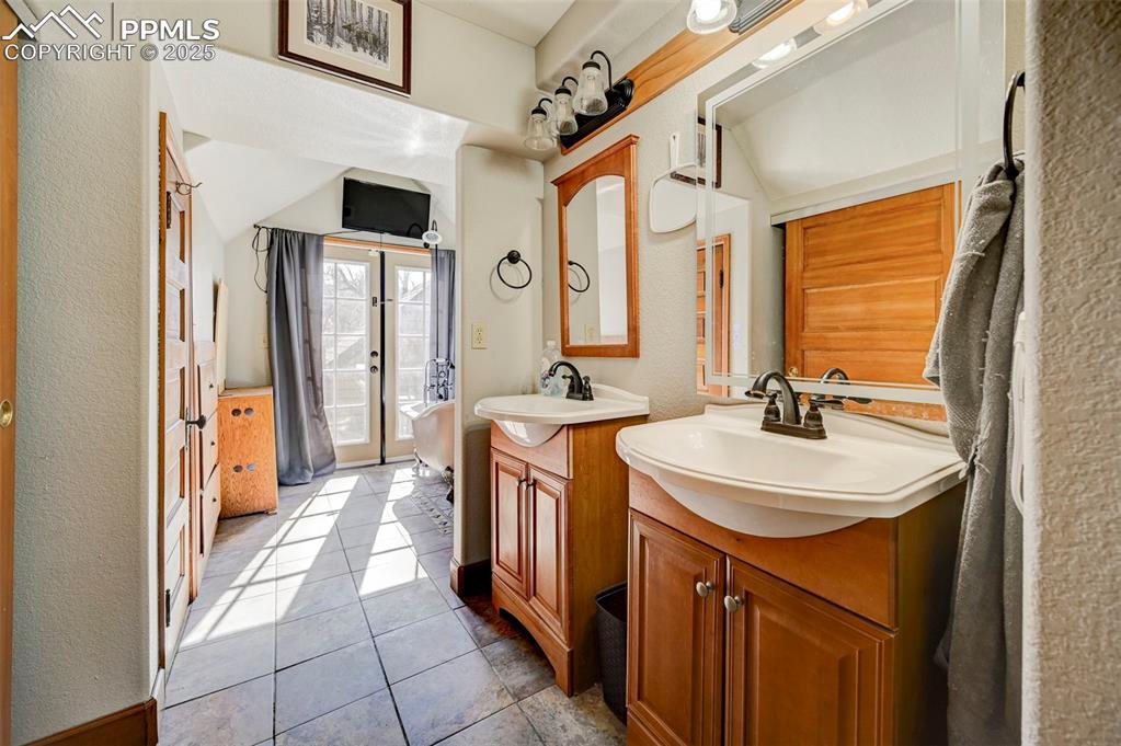 Image 13 of 36: FRENCH DOORS TO THE UPPER DECK, DOOR ON LEFT IS ADDITIONAL STG