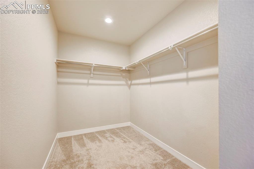 Image 21 of 39: Primary closet 