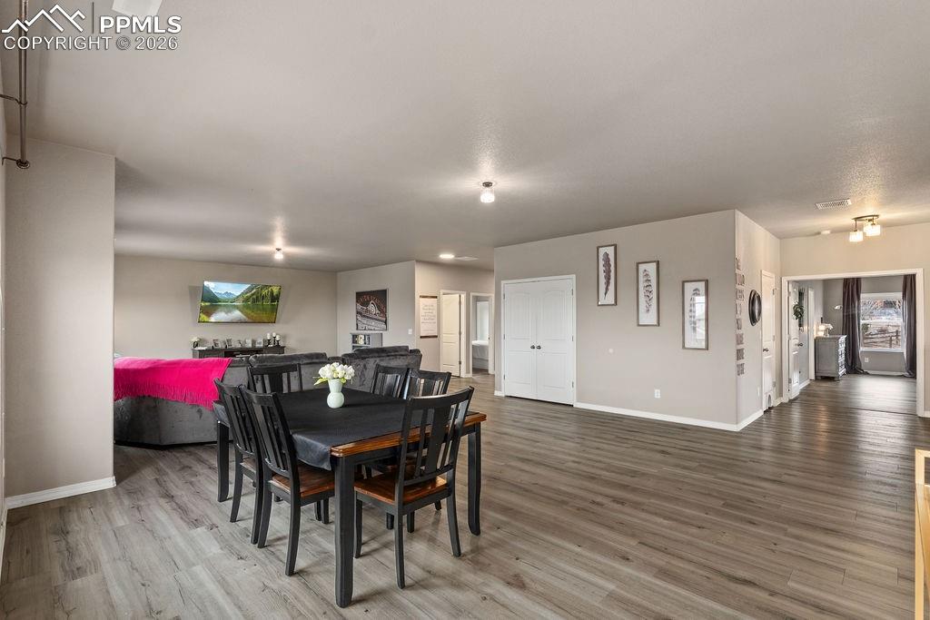 Image 21 of 43: Family room with light wood-style floors and washer / dryer