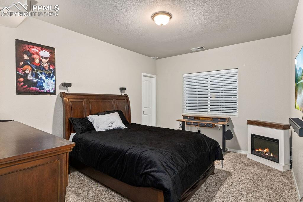 Image 39 of 43: Basement bedroom #1 with an egress window.
