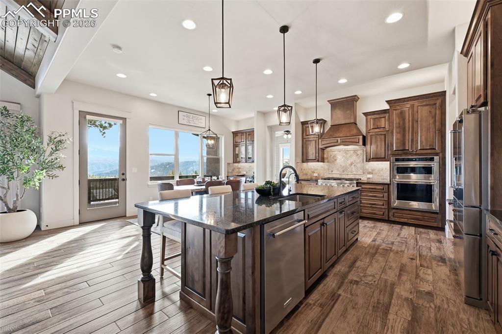 Image 18 of 49: Walk out to the deck that extends the full length of the home!