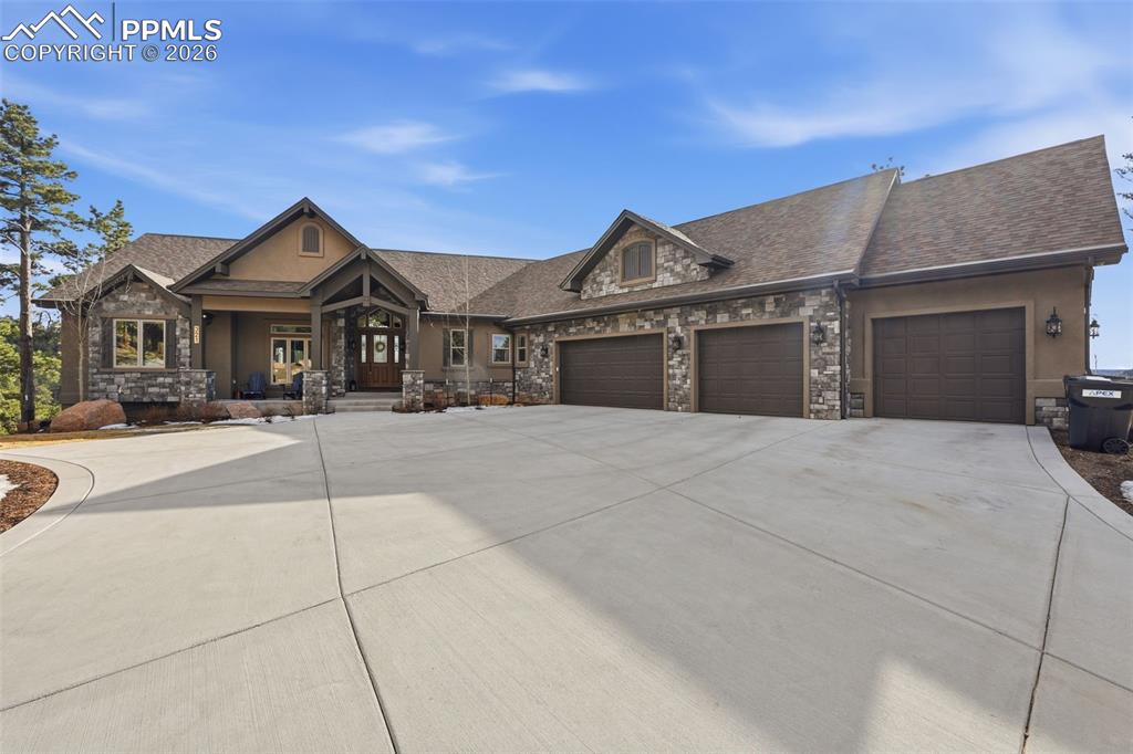 Image 2 of 49: Gorgeous home with four car garage and covered porch!