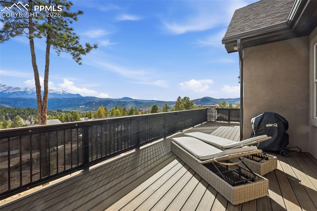 Image 23 of 49: The deck runs the full length of the house!