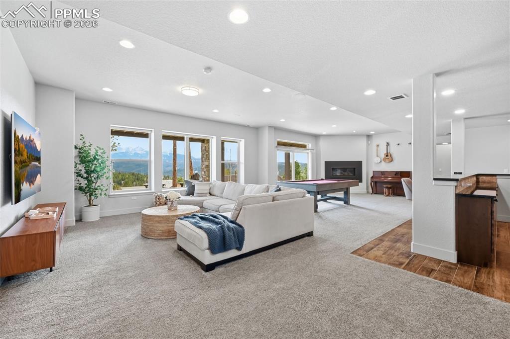 Image 35 of 49: Spacious basement rec room with walk out to basement patio!