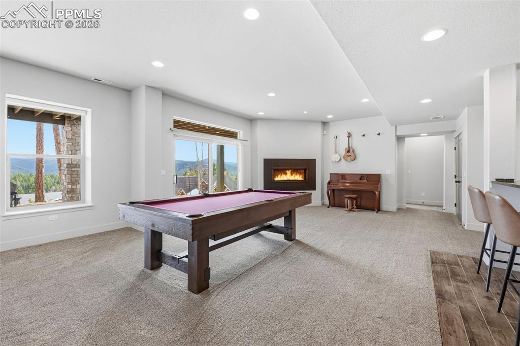 Image 38 of 49: Large rec room for all kinds of activities! Pool table included!