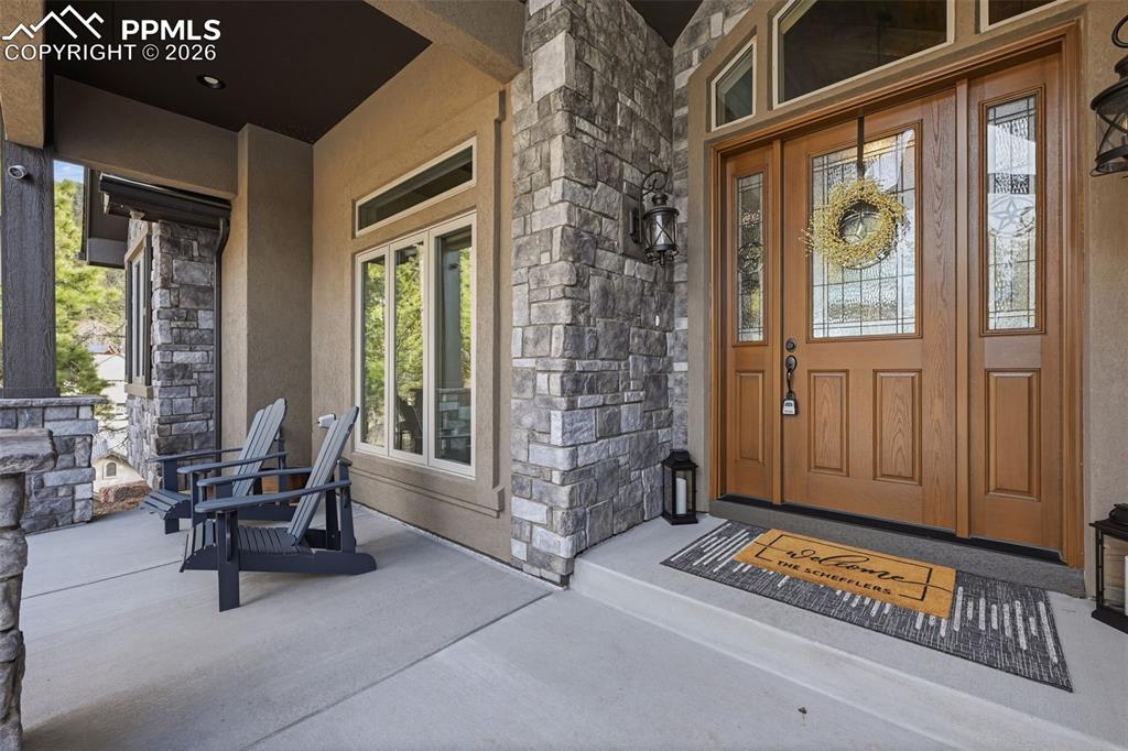Image 6 of 49: Welcoming entry and covered porch!