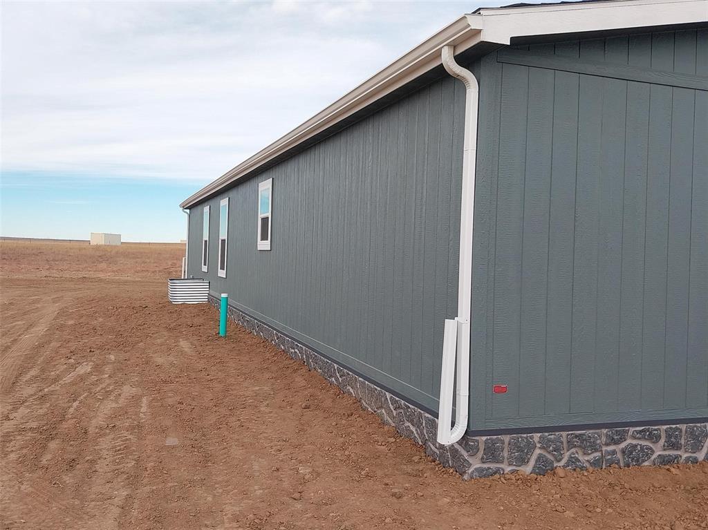 Image 20 of 28: View of side of home