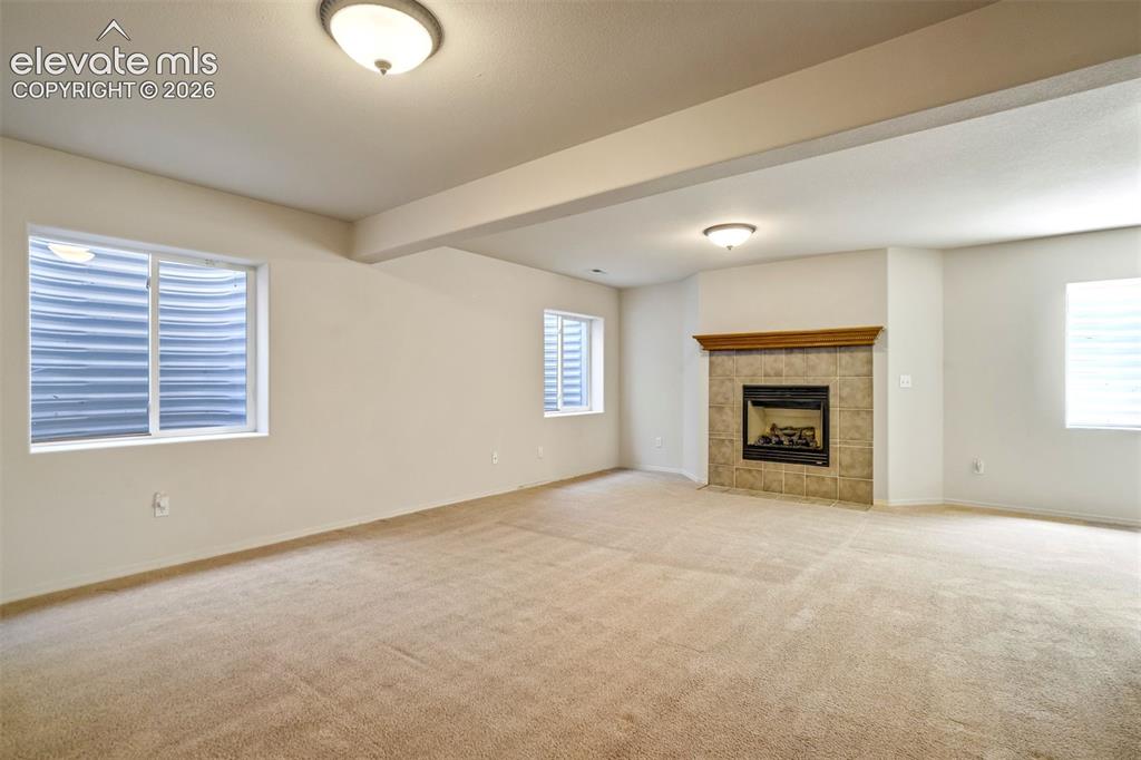 Image 22 of 41: 2nd gas fireplace in basement
