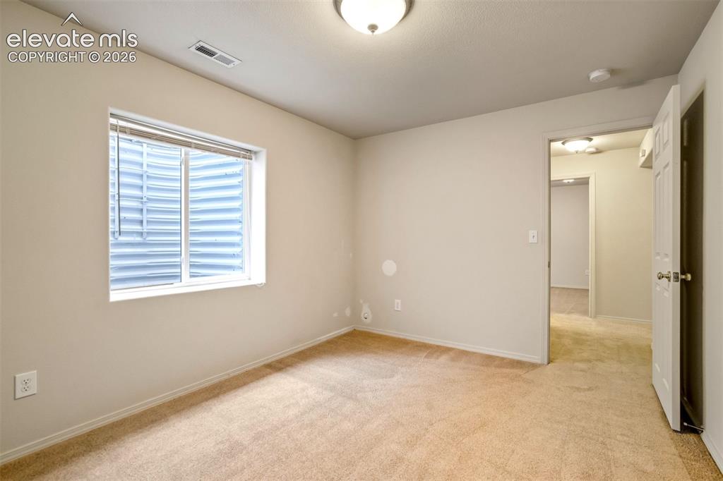 Image 25 of 41: One of 2 basement bedrooms