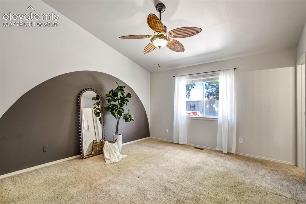 Image 9 of 41: Spacious room with vaulted ceiling