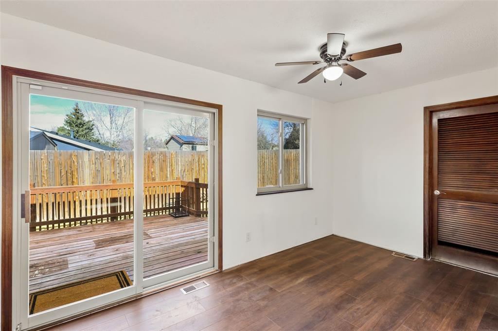 Image 10 of 32: View of dining area with a view of the wooden deck