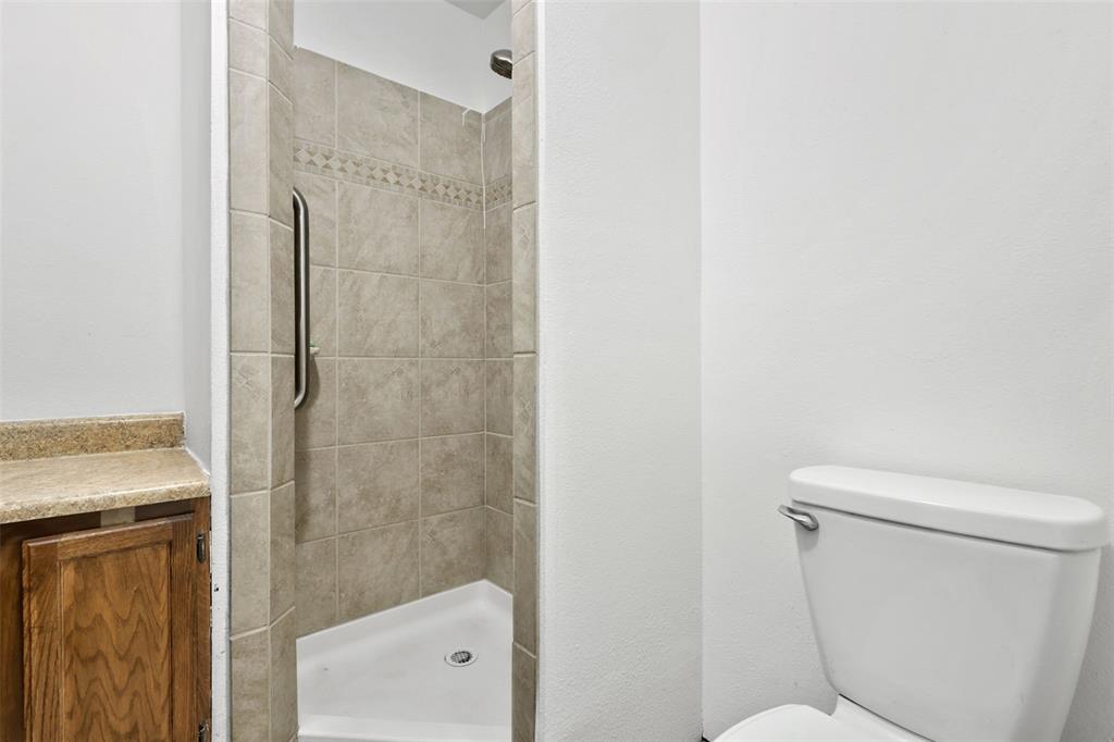 Image 19 of 32: Primary bathroom with newer shower