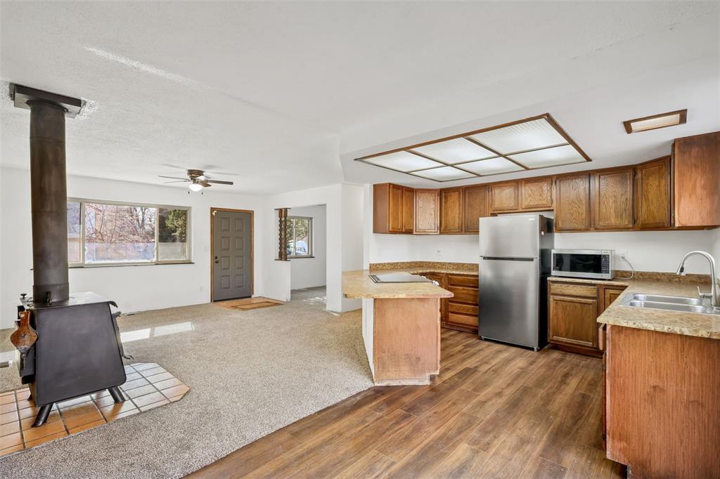 Image 8 of 32: View of living room and kitchen