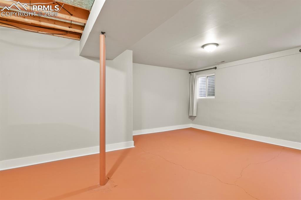 Image 22 of 30: Below grade area with baseboards