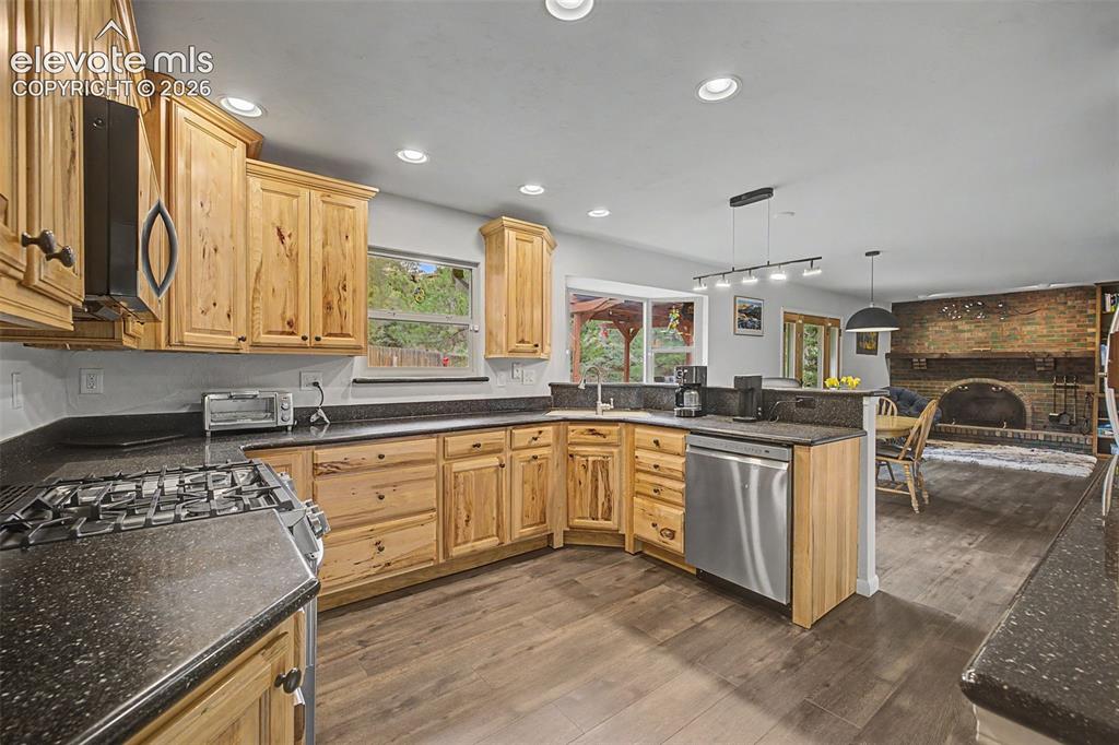 Image 14 of 43: Magnificently upgraded kitchen featuring stainless steel appliances, beauti
