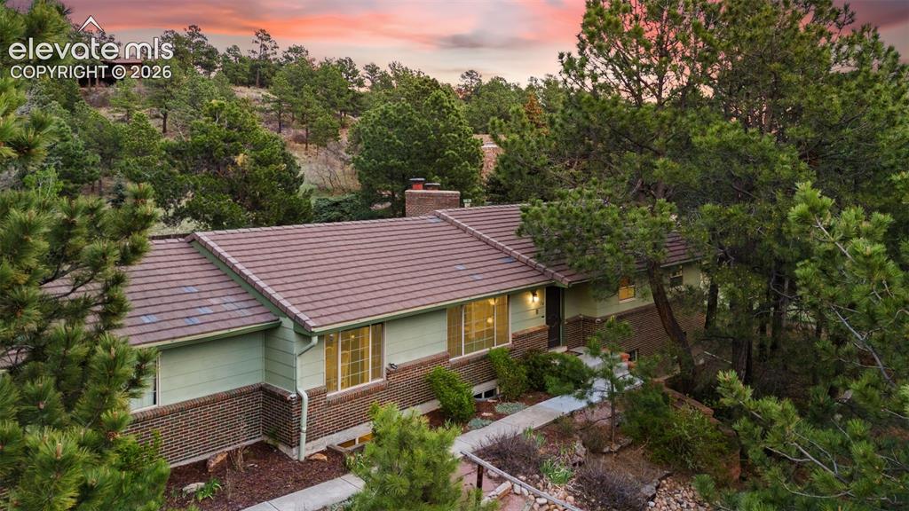 Image 38 of 43: Gorgeous view of the front of the home at sunset