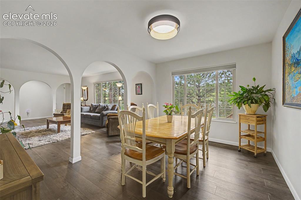 Image 9 of 43: Spacious dining room featuring stunning details and views