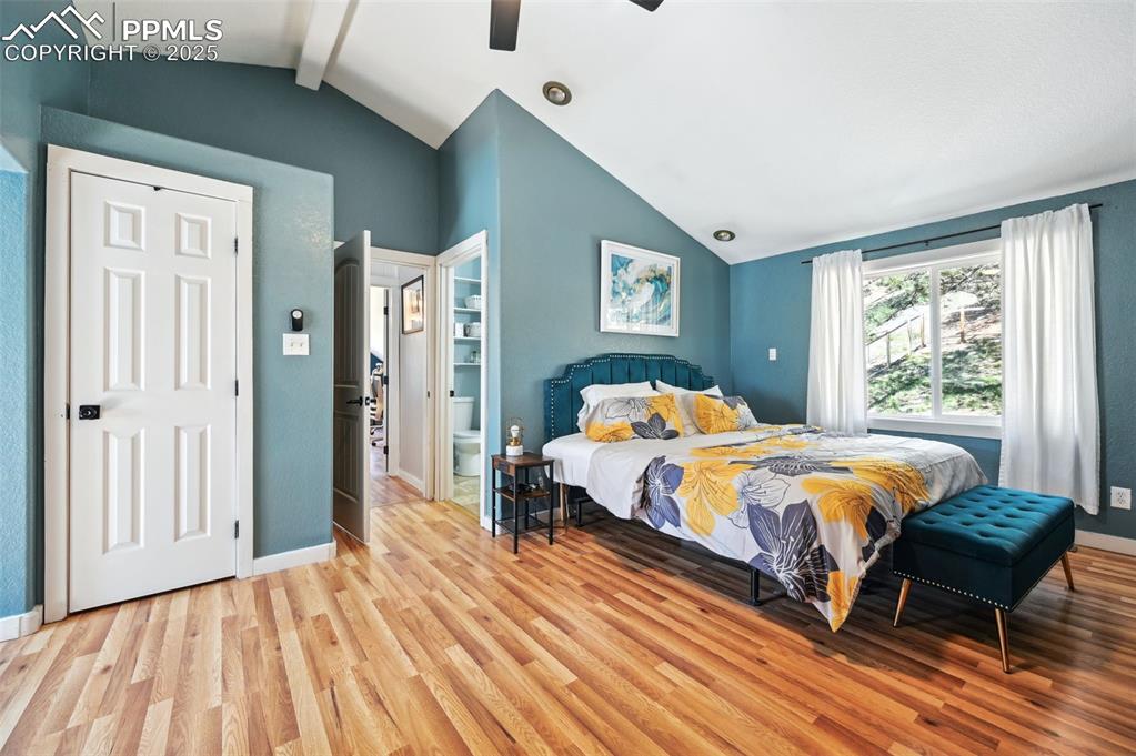 Image 14 of 49: Bedroom with light wood-style floors and ceiling fan