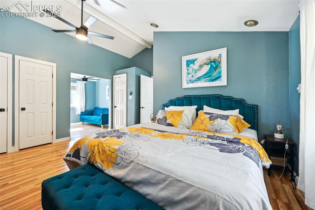 Image 18 of 49: Bedroom with wood finished floors and ceiling fan
