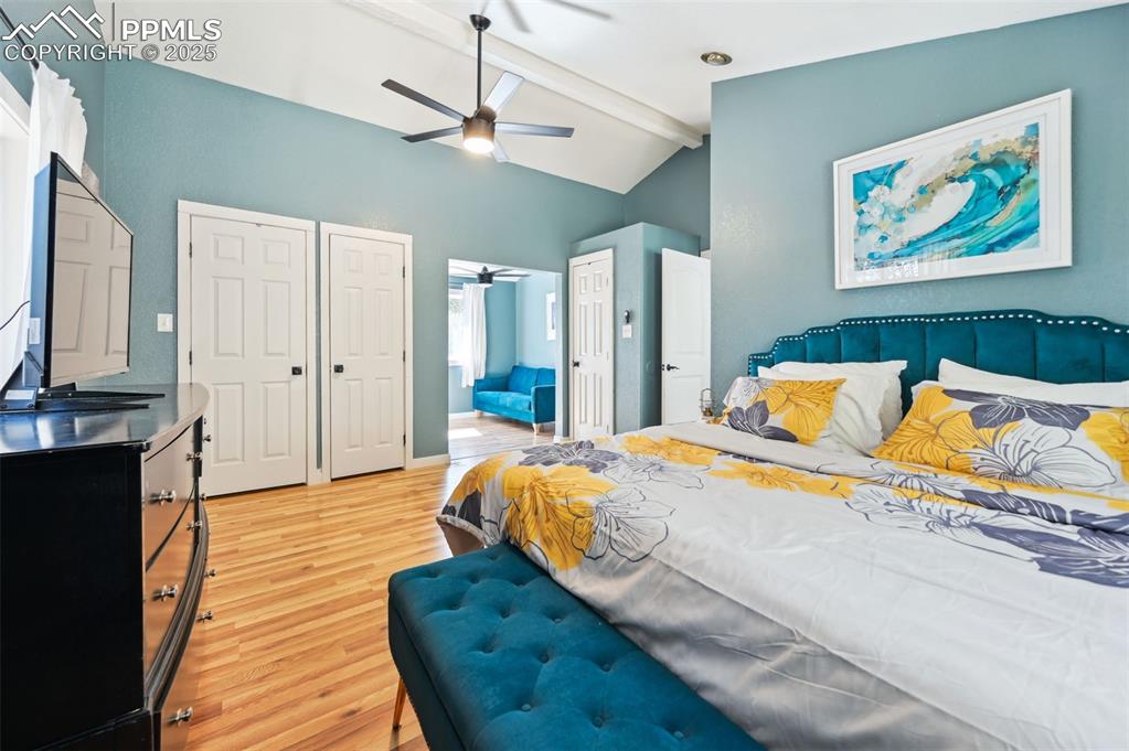 Image 19 of 49: Bedroom featuring light wood-style flooring, multiple closets, and ceiling 