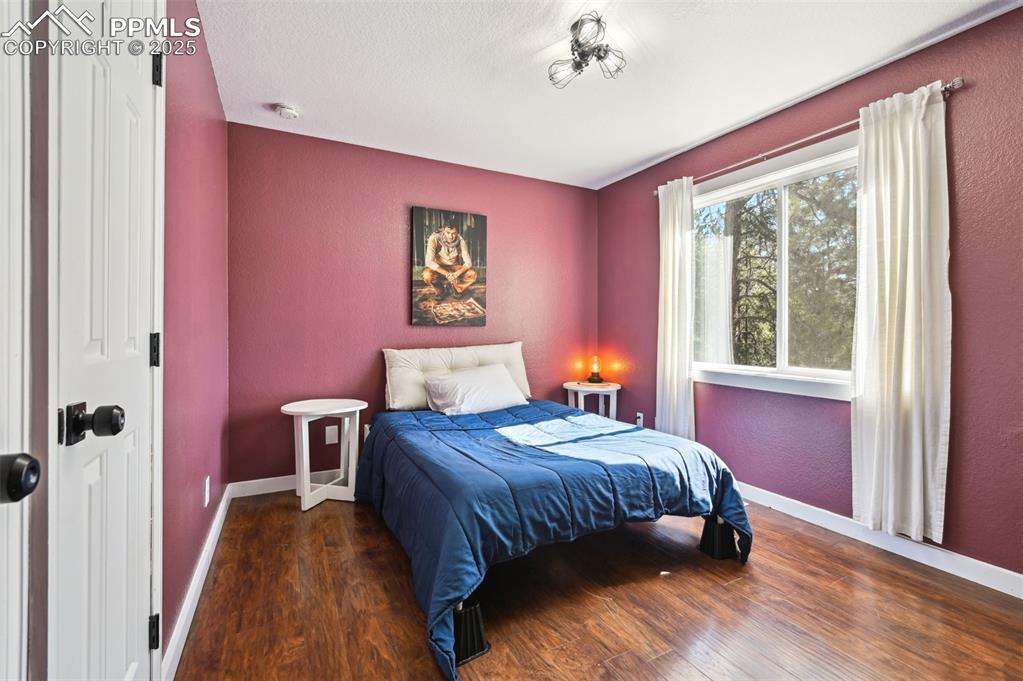 Image 26 of 49: Bedroom featuring wood finished floors