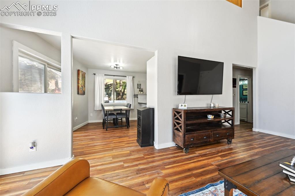 Image 6 of 49: Living area featuring wood finished floors