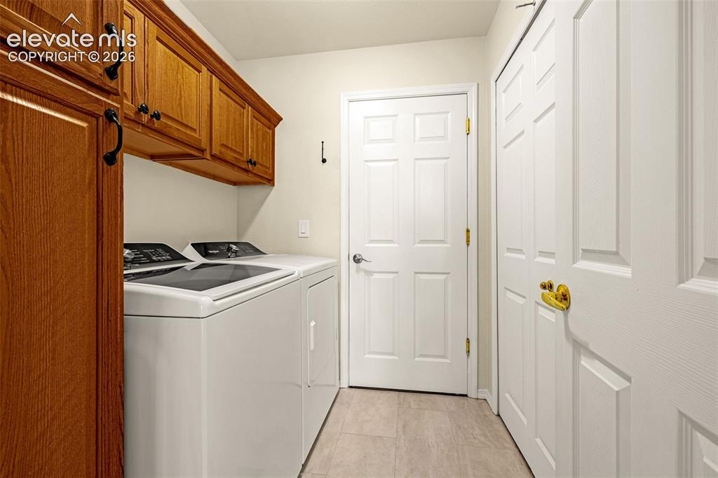 Image 17 of 50: Mud Room with Laundry and Garage Access