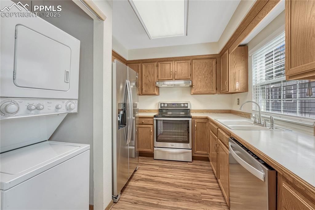 Image 10 of 28: Kitchen with stainless steel appliances...