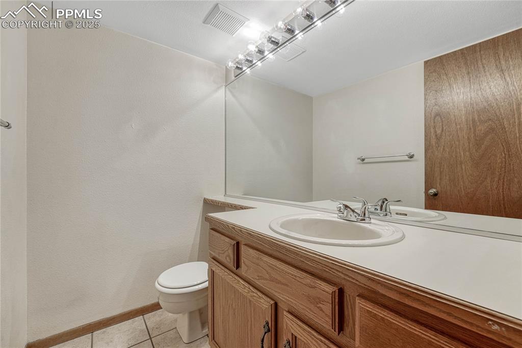 Image 13 of 28: Powder room on the main floor.