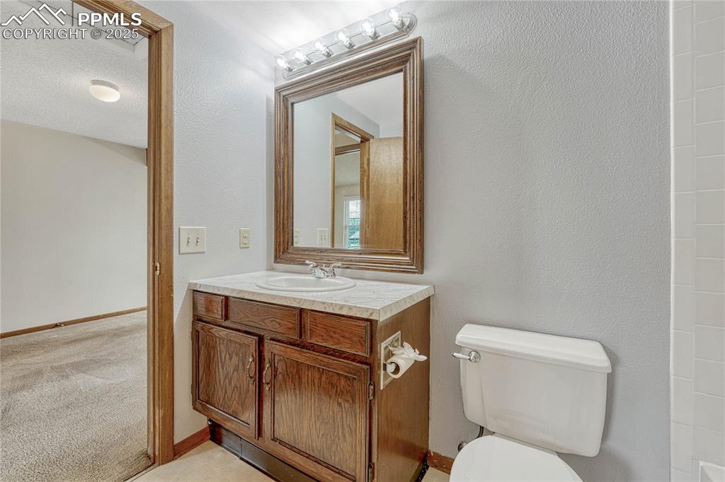 Image 21 of 28: Upstairs full bath.