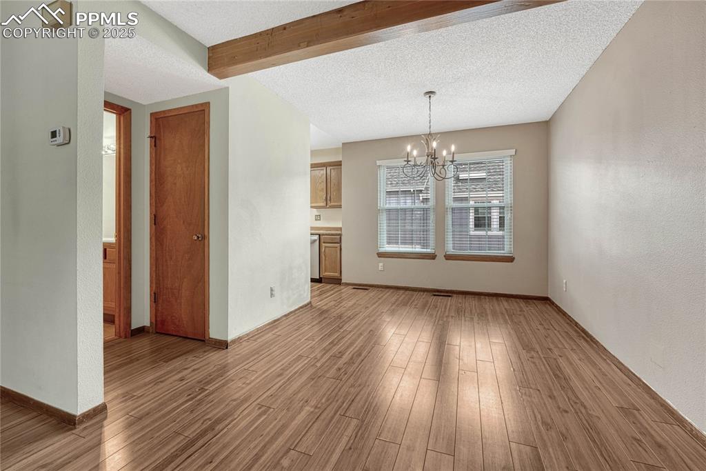 Image 8 of 28: Dining area and powder room on the main floor.