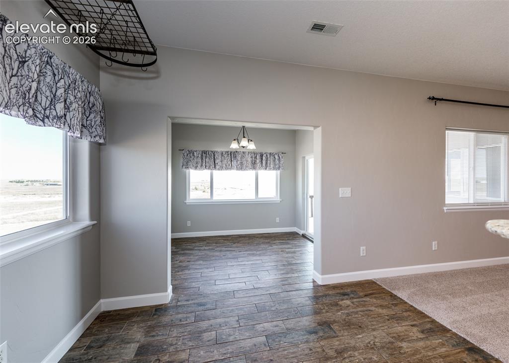 Image 10 of 27: Eat in dining room with bonus sunroom!