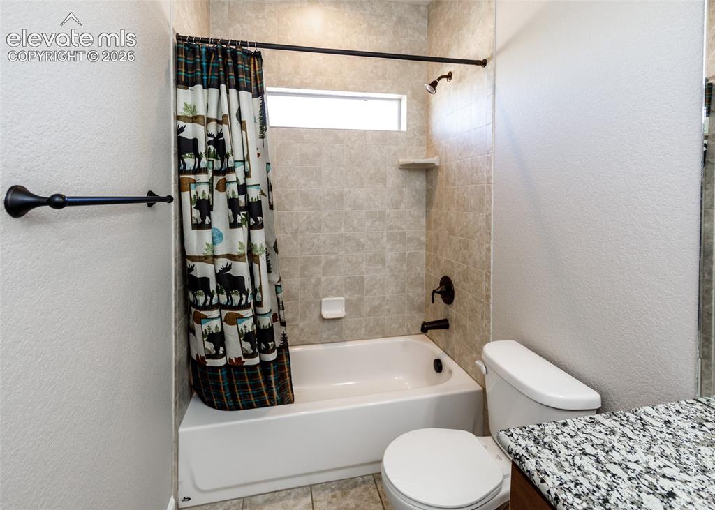 Image 14 of 27: Custom tile in the main bath/shower.