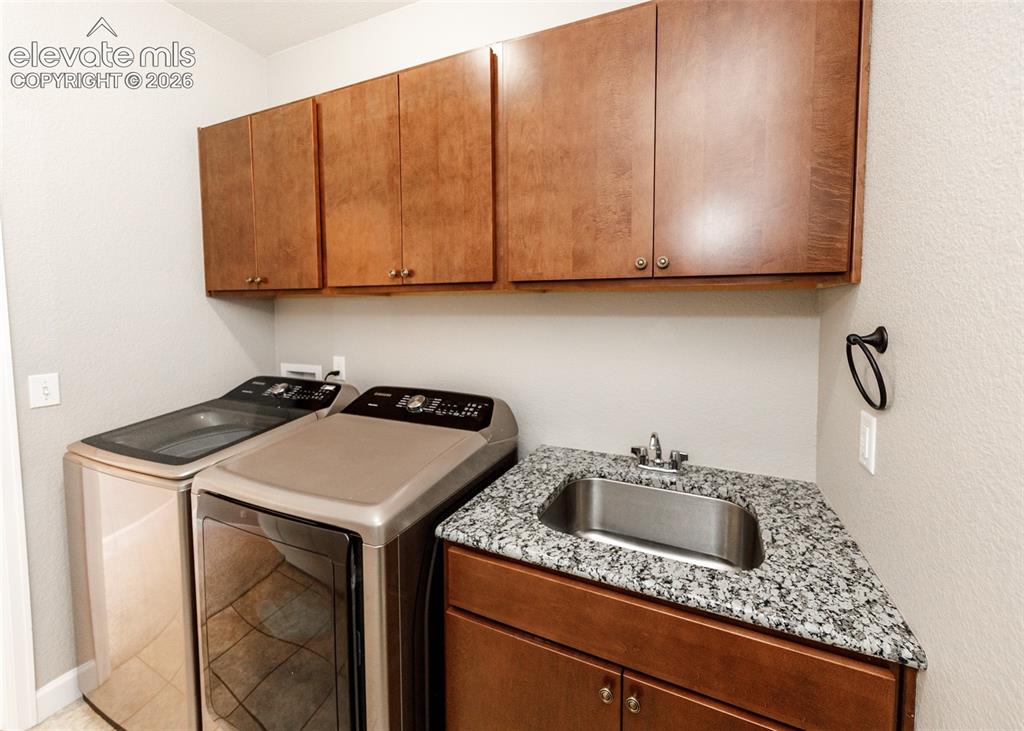 Image 15 of 27: Convenient sink in the laundry area.