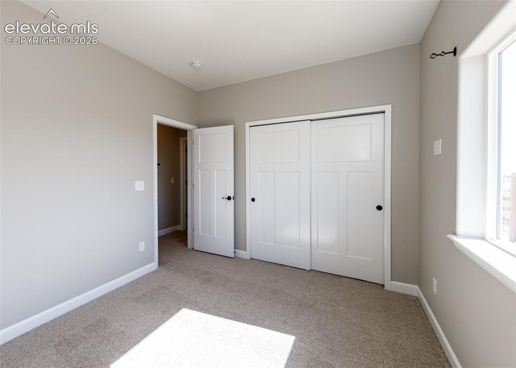 Image 22 of 27: Additional secondary bedroom.