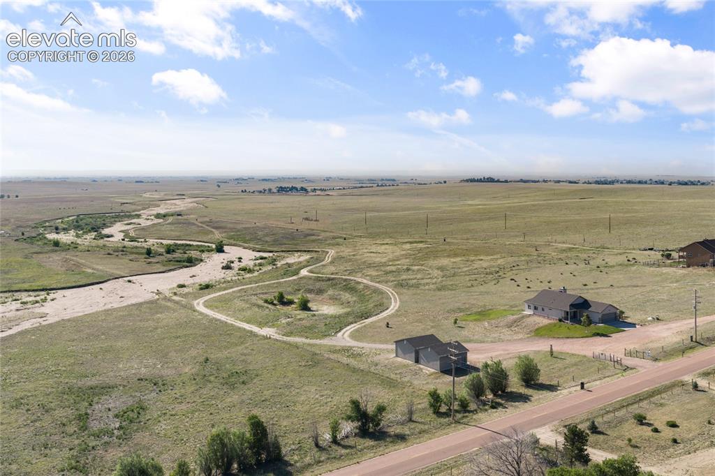Image 24 of 27: The property offers an expansive lot with plenty of room to roam, ensuring 