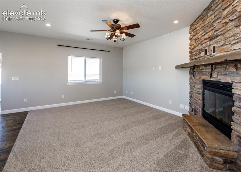 Image 7 of 27: Open floor plan with family room. New Carpet throughout.