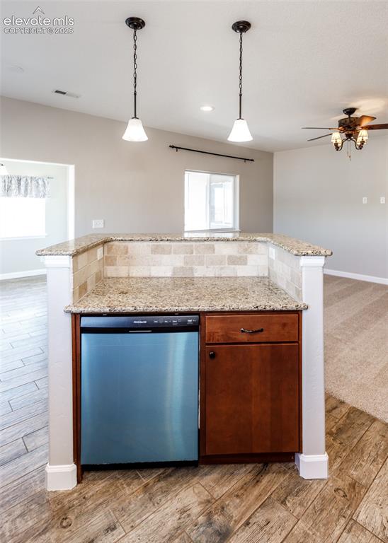 Image 9 of 27: Kitchen into family room is perfect for entertaining!
