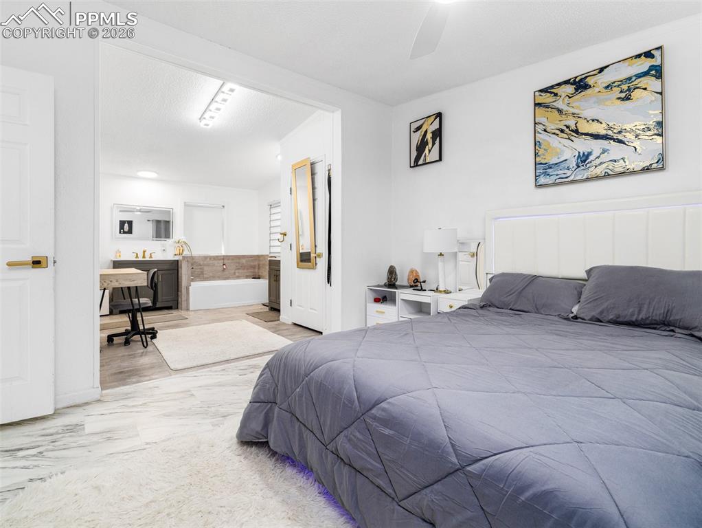 Image 21 of 29: Bedroom featuring ceiling fan