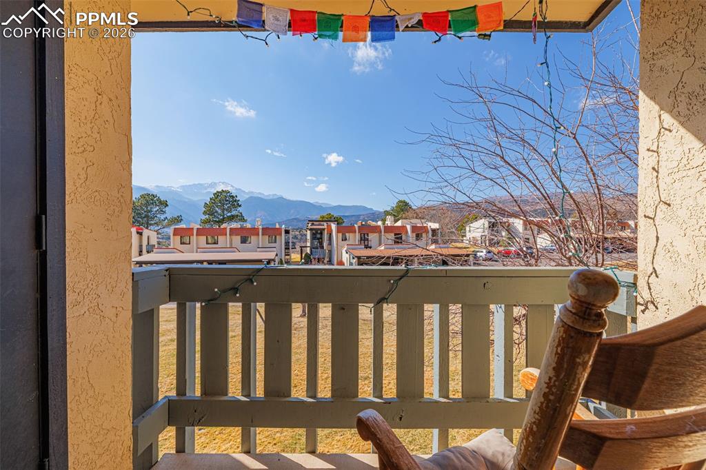 Image 17 of 29: Balcony with a residential view and a mountain view