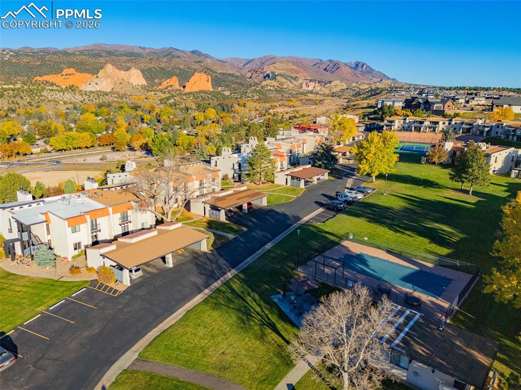 Image 26 of 29: Aerial perspective of suburban area featuring a mountain backdrop